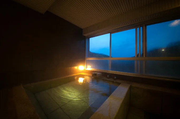 A panoramic private hot-spring bath in a Bourou NOGUCHI Noboribetsu suite