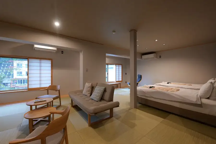 Japanese-style room with a private hot-spring bath at Kusatsu Hotel 1913