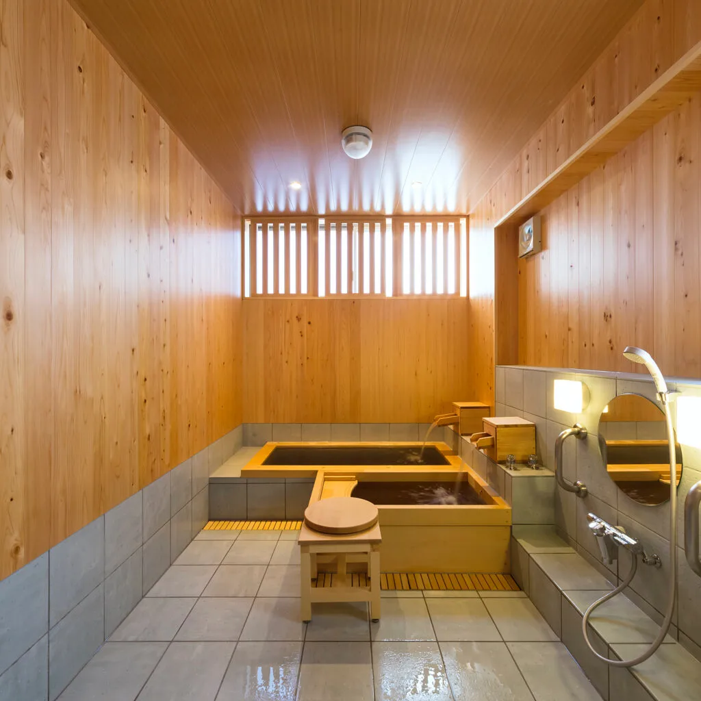 Modern wood and concrete details at Togoshi Ginza Onsen