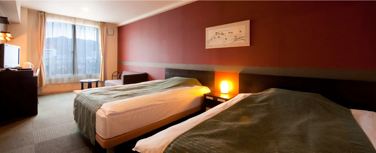 South-facing twin room at Hotel Aile with a Beppu Bay view
